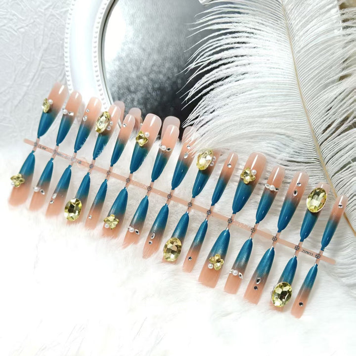 Artificial nails with glamorous stone applications Bowlift