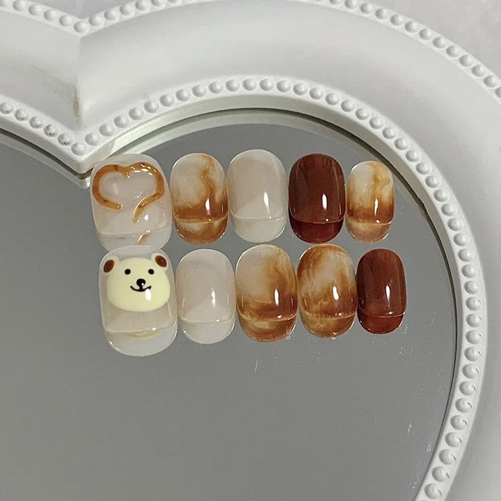 Artificial nails with cute bear design and marbled pattern Bowlift