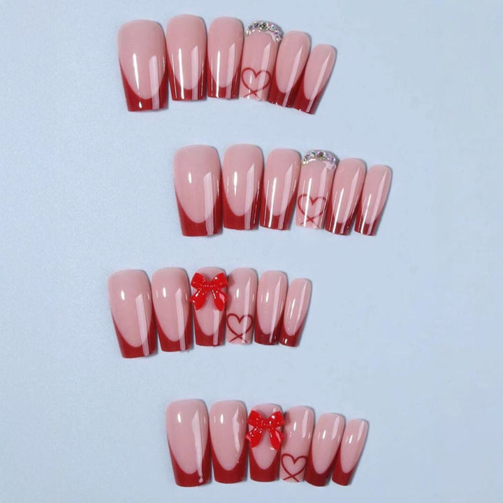 Nail art with heart and bow motifs Bowlift