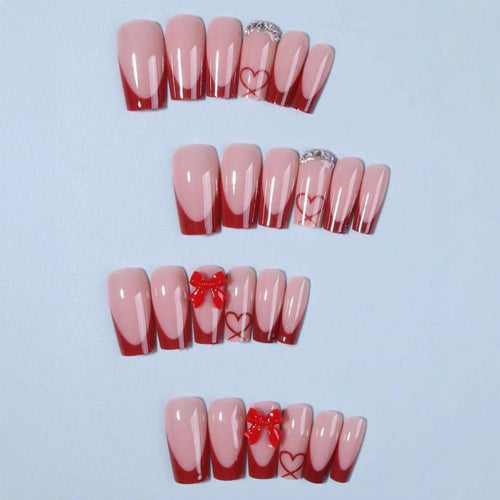 Nail art with heart and bow motifs Bowlift