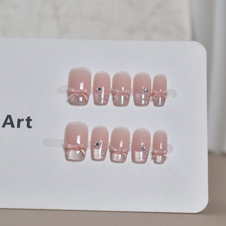 Elegant French Tip Press-On Nail Art with Bow Accents Bowlift