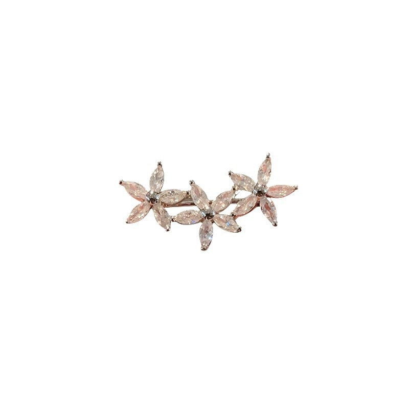 Flower brooch made of radiant gemstones Bowlift