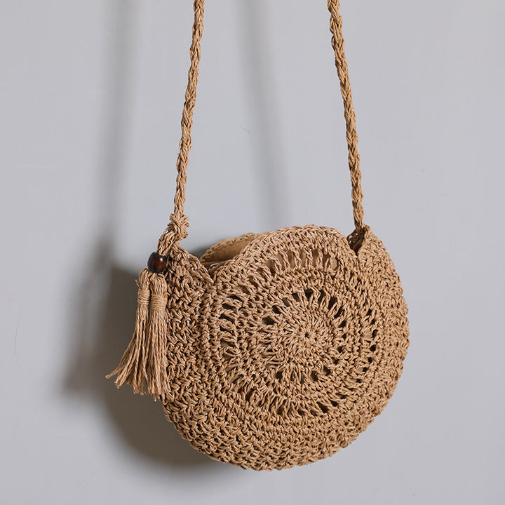 Round bag made of natural jute material with trendy fringe detail Bowlift