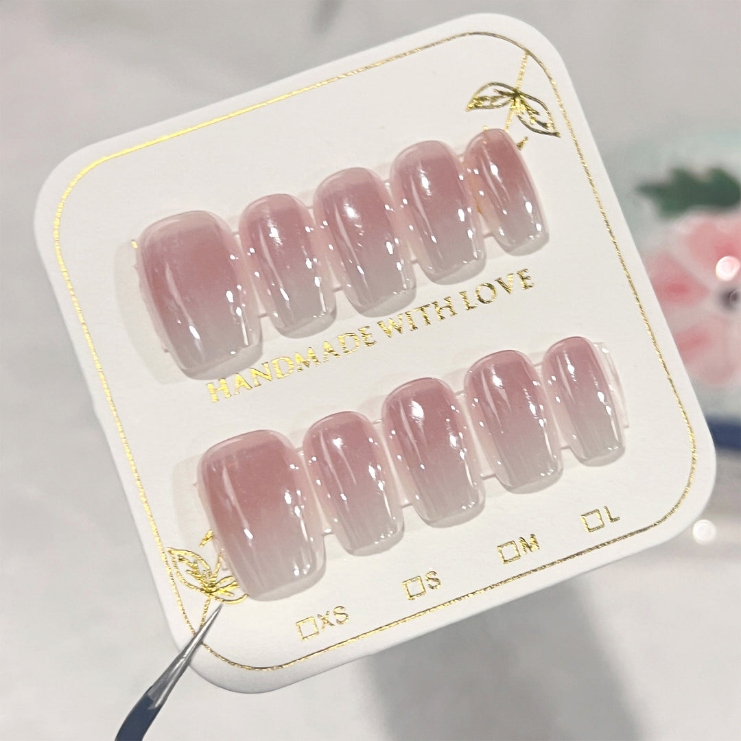 Artificial nail extensions in elegant ombre design Bowlift
