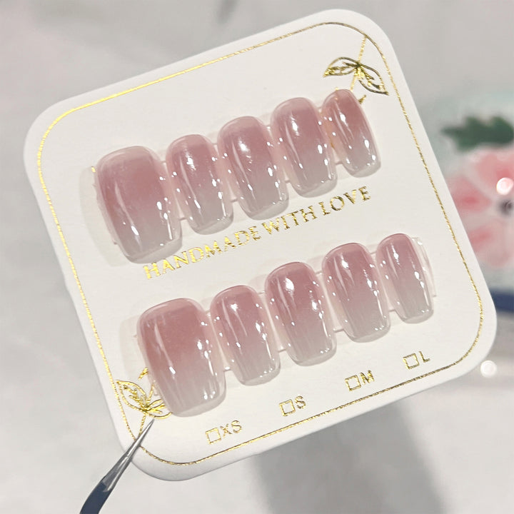 Artificial nail extensions in elegant ombre design Bowlift
