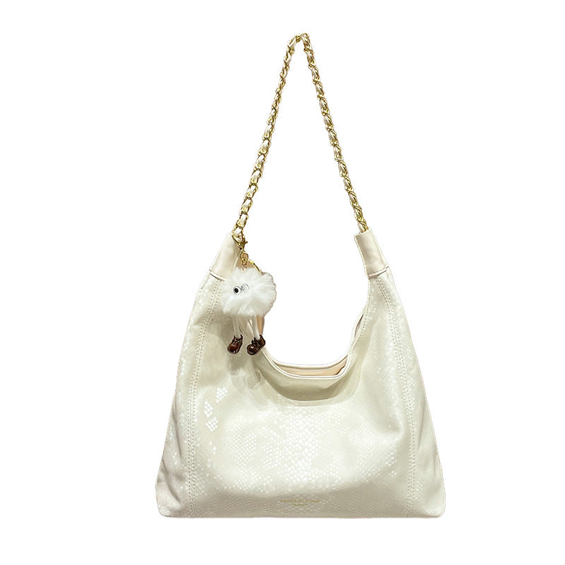 Chic Shoulder Bag with Decorative Charm