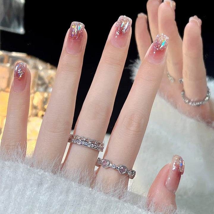 Glamorous artificial nails with heart-shaped accents Bowlift
