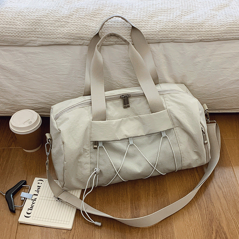 Sporty shoulder bag with adjustable carrying handles and breathable mesh material Bowlift