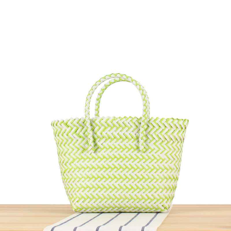Tote bag made of handwoven natural material with braided design Bowlift