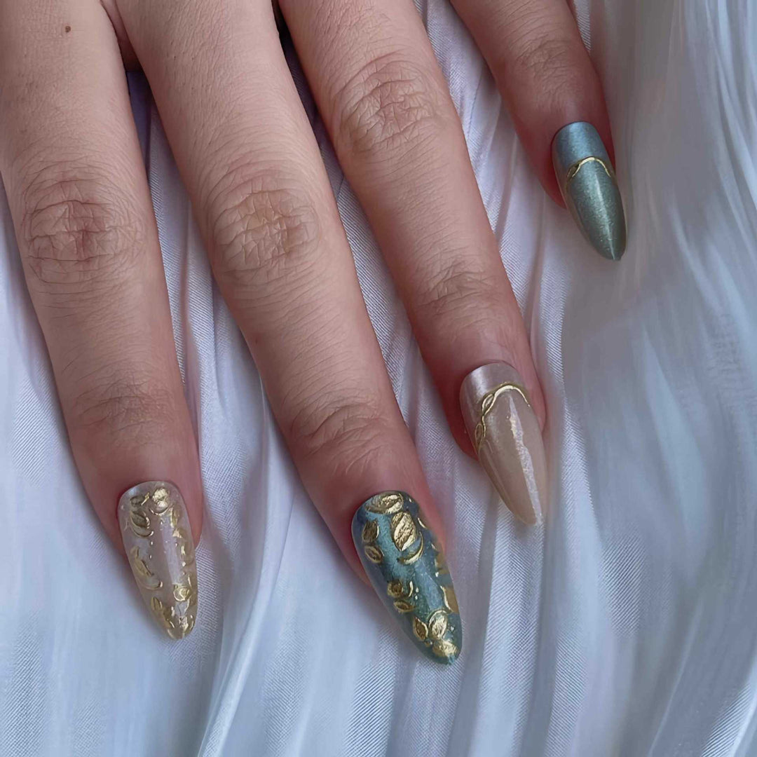Artistic Stiletto Press-On Nail Set with Elegant Gold Accents Bowlift