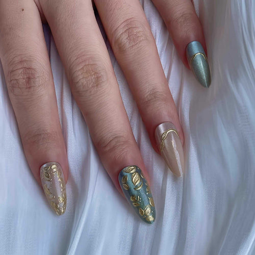 Artistic Stiletto Press-On Nail Set with Elegant Gold Accents Bowlift