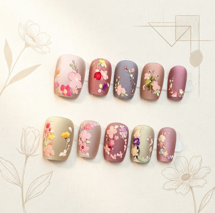 Art nail design with floral motifs Bowlift