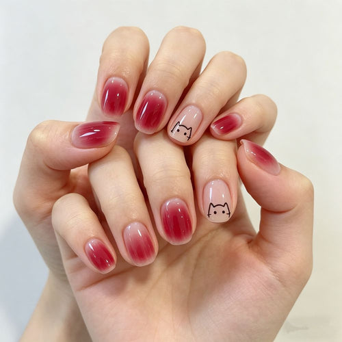 Artificial nails with elegant ombre effect and playful cat design Bowlift
