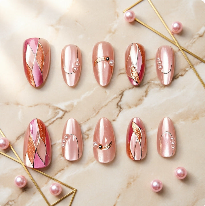 Artificial nails with elegant pearl and gold accents Bowlift