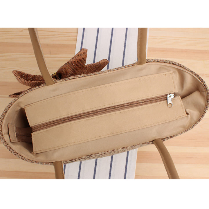 Handbag with floral appliqué Made of natural material Bowlift