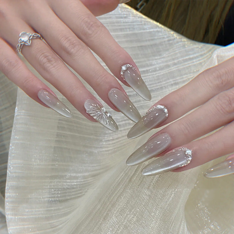 Elegant Stiletto Press-On Nail Extensions with Floral and Rhinestone Accents Bowlift
