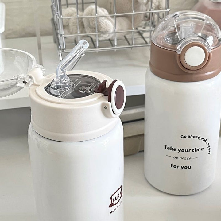 Women's insulated drinking bottle with innovative flip lid and practical handle Bowlift