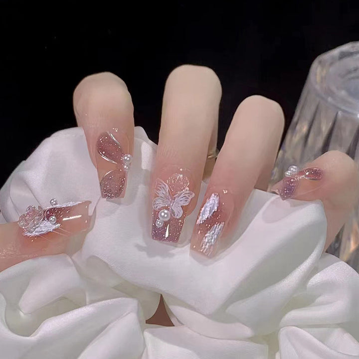Glamorous artificial nails with delicate flower and glitter effects Bowlift