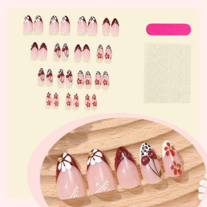 Elegant artificial nails with floral accents and glitter Bowlift