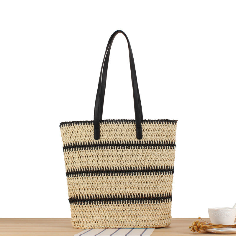 Fashionable beach bag made of woven natural material with elegant straps Bowlift