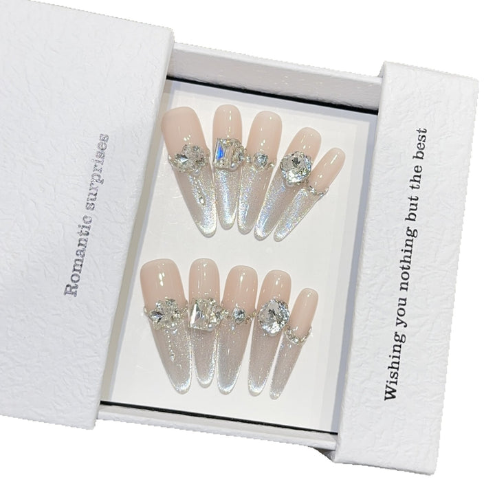 Glamorous artificial nails with sparkling rhinestone embellishments Bowlift