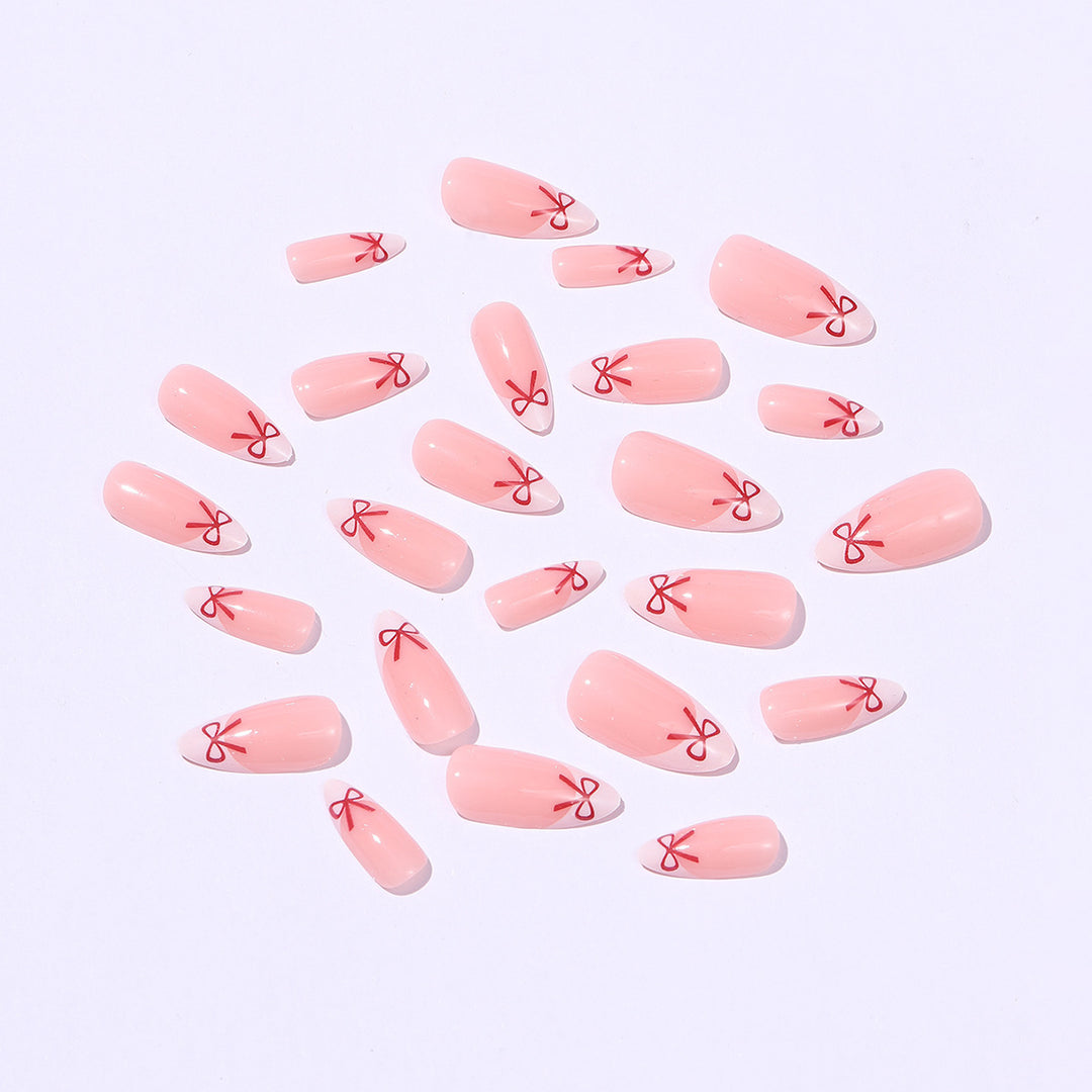 Artificial nail set with playful bow design Bowlift