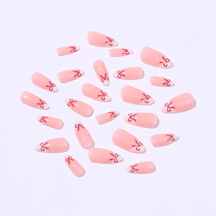Artificial nail set with playful bow design Bowlift