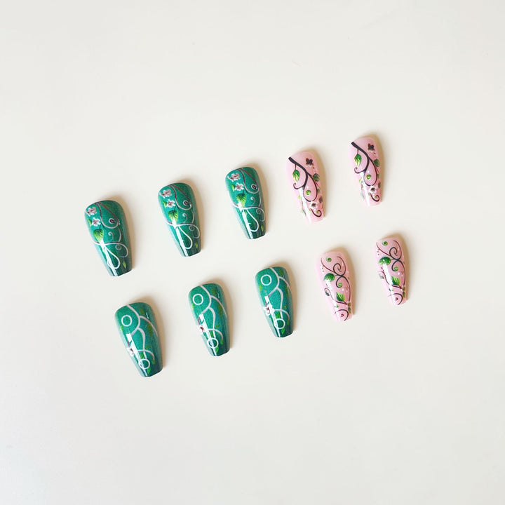 luxurious artificial nail set with floral designs and detailed accents Bowlift