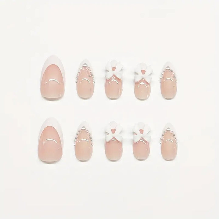 Artistic Press-On Nail Design with Bow Accents Bowlift