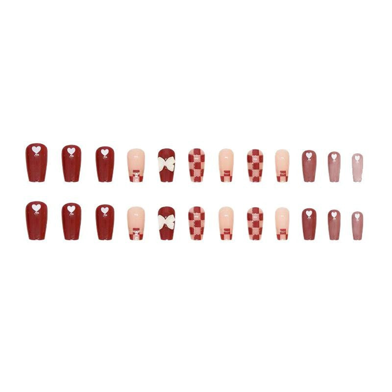 Artificial nails with decorative heart and bow details Bowlift