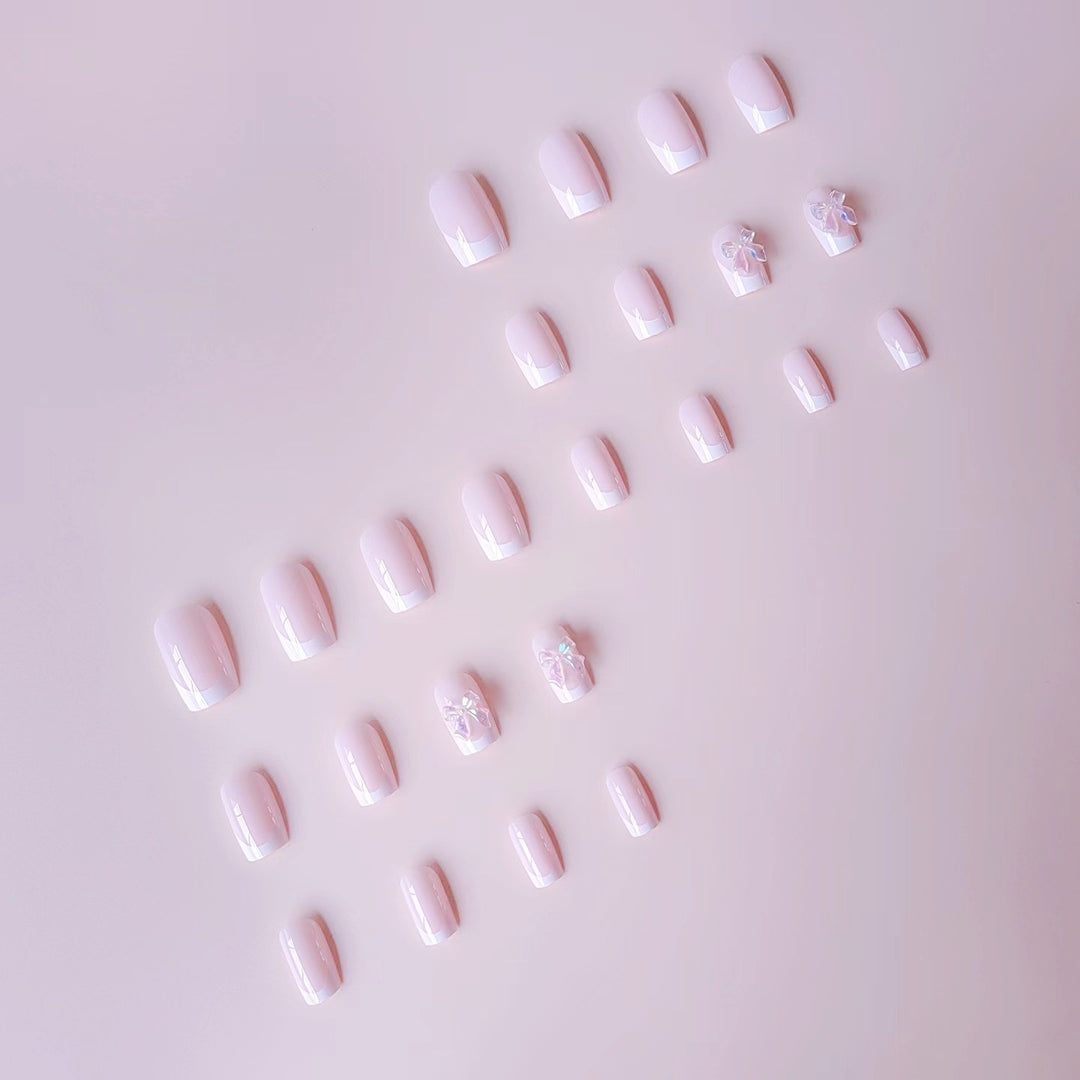 Acrylic nail set with elegant French tips and 3D details Bowlift