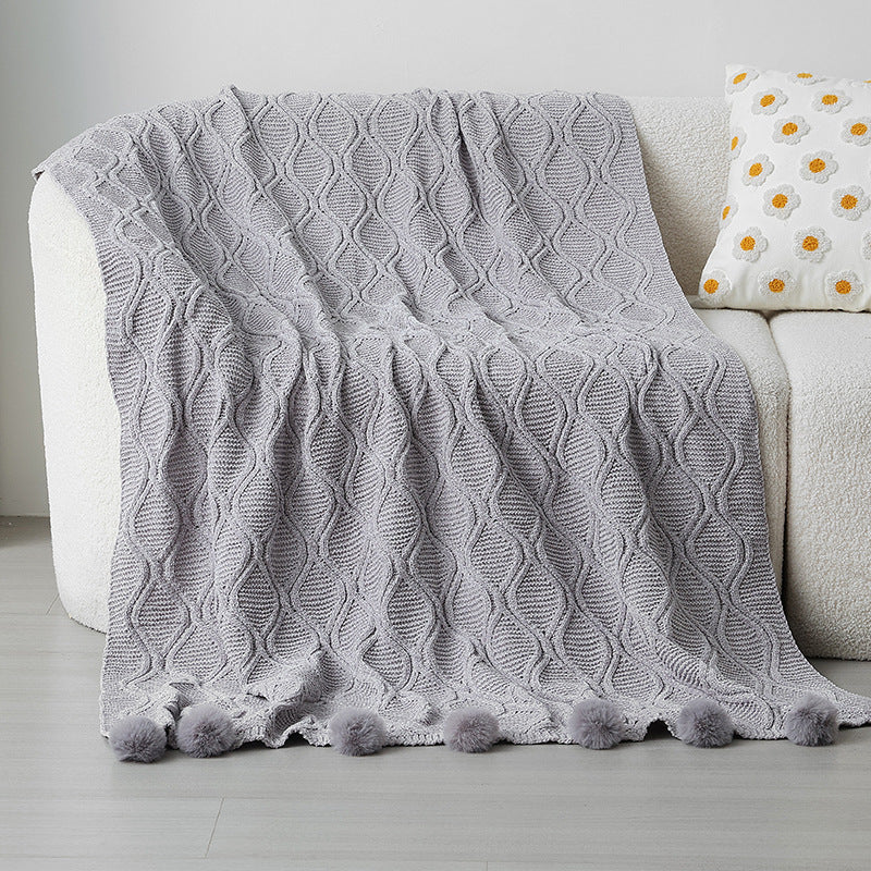 Ladies knit blanket with decorative pom poms Bowlift