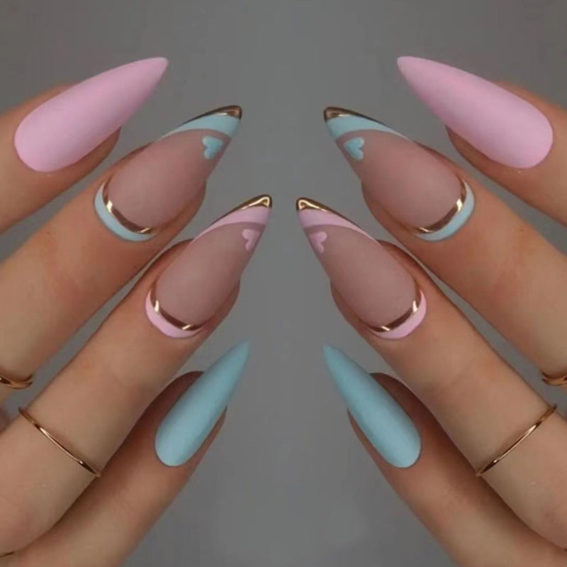 Artistic stiletto nails with gold accents and heart design Bowlift