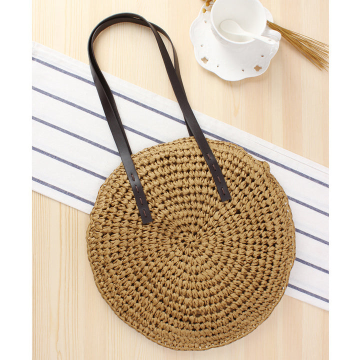 Round basket bag with sturdy leather handles Bowlift