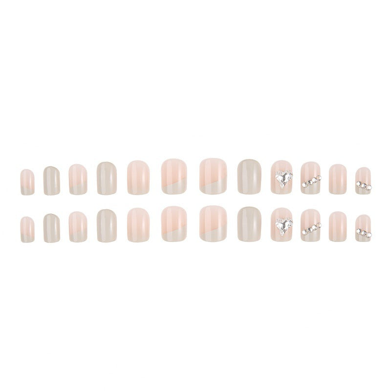 Glamorous artificial nails with heart and rhinestone decorations Bowlift