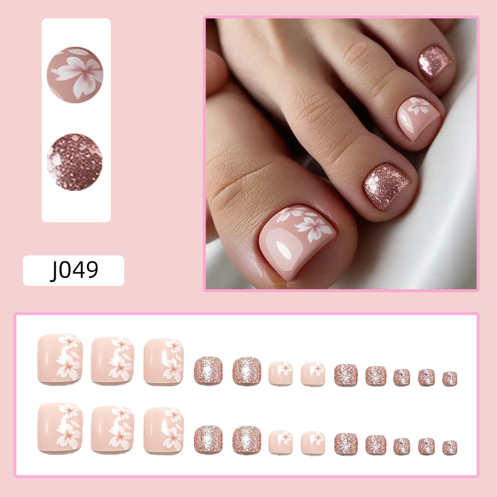 Fingernail art set with elegant floral design and glitter accents Bowlift