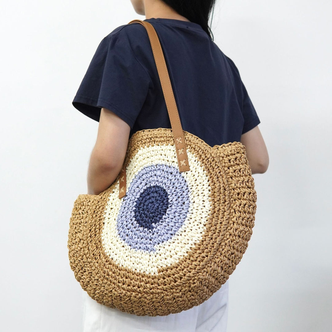 Braided basket bag with unique round design and elegant shoulder straps Bowlift