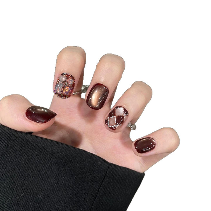 Artificial nails with creative rhinestone design Bowlift