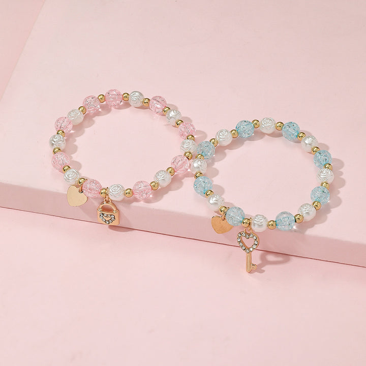 Playful bracelet set with heart and key design Bowlift
