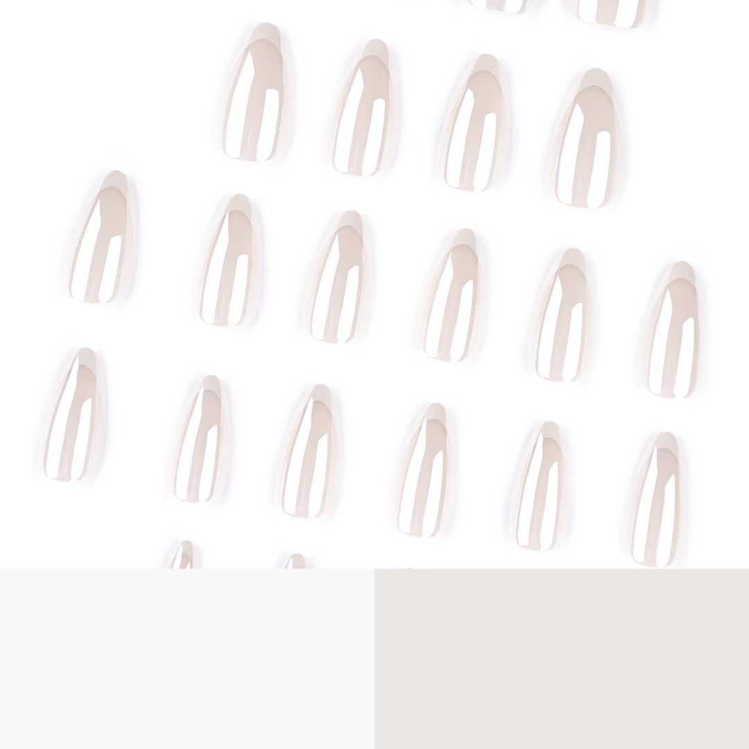 Artistic stiletto nails with elegant French tip embellishments Bowlift