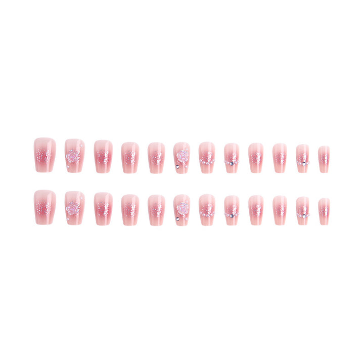Artificial nail set with sparkling glitter and pearl decorations Bowlift