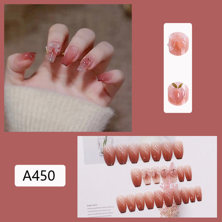 Artificial nails with heart accent and glamorous decorations Bowlift