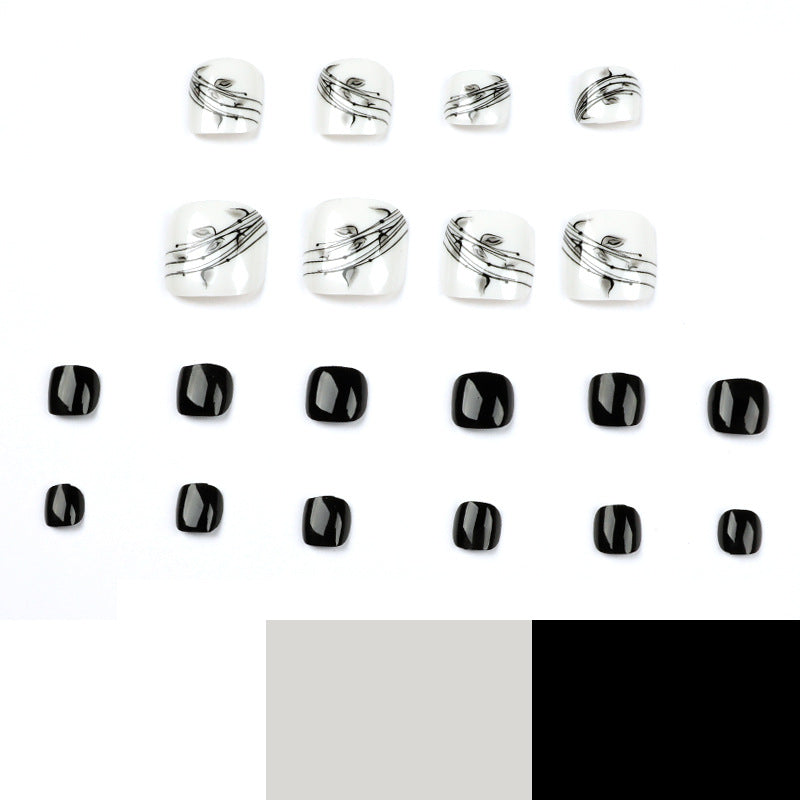 Artful toenail art in elegant black and white design Bowlift