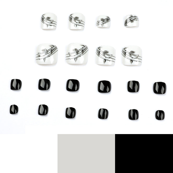Artful toenail art in elegant black and white design Bowlift