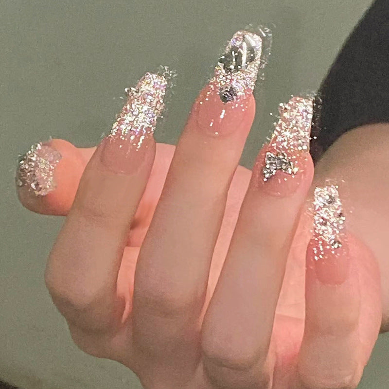 Glamorous artificial nails with sparkling rhinestones and elegant designs Bowlift