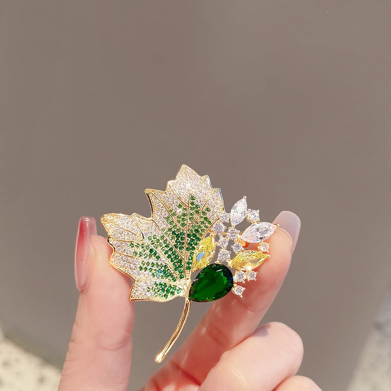 Exquisite leaf brooch with sparkling crystals Bowlift