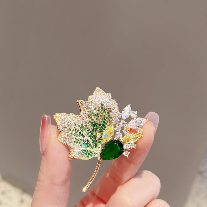 Exquisite leaf brooch with sparkling crystals Bowlift