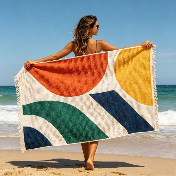 Beach towel with tropical leaf and flower design Bowlift