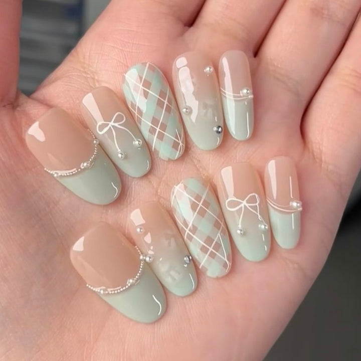 Decorative Press-On Nail Extensions with Bow and Rhinestone Accents Bowlift