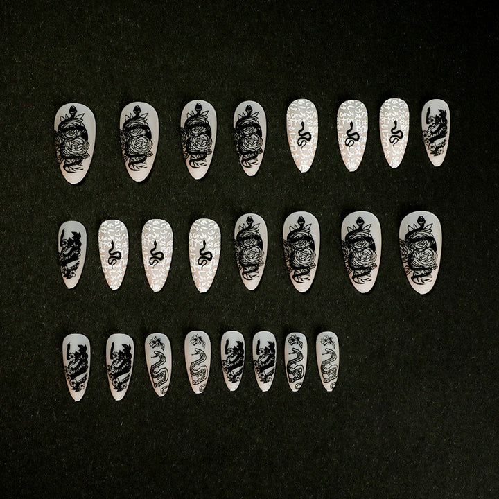 Artful nail extensions in elegant stiletto style with artistic floral and graphic designs Bowlift
